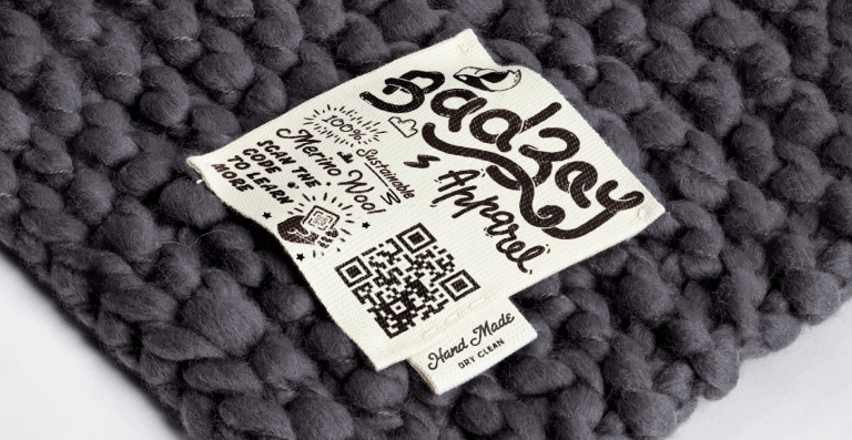 QR Code on a merino wool blanket prompting people to scan to learn more