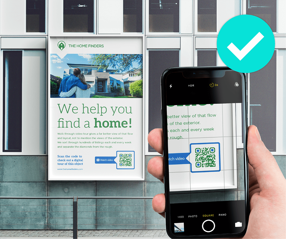 An example of someone scanning a QR Code on a billboard