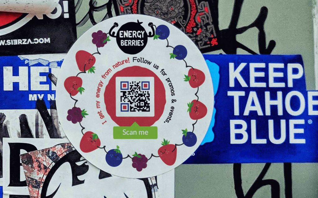 A large, branded sticker with a QR Code on it
