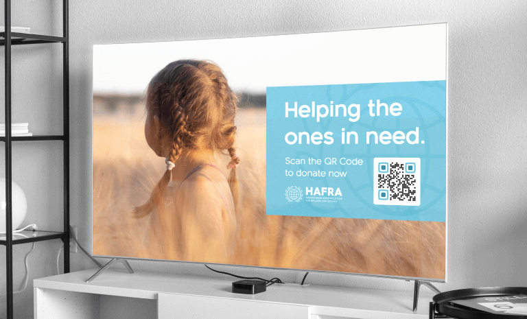 A QR Code on TV offering viewers the opportunity to help through donation.