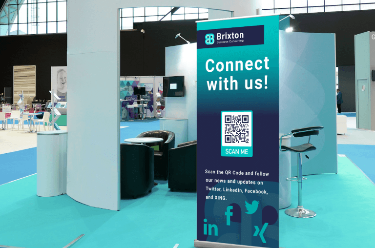 A QR Code on a sign helps trade show attendees find brands on social media