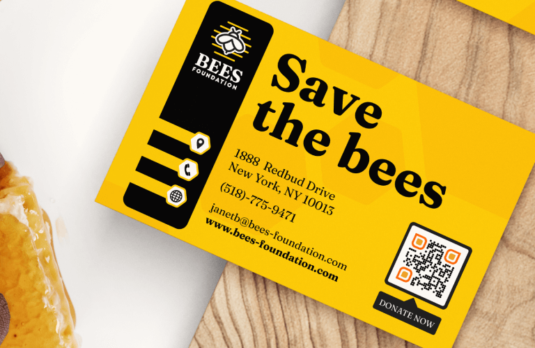 An example of a QR Code on a business card that uses a QR Code frame with the call to action "DONATE NOW"