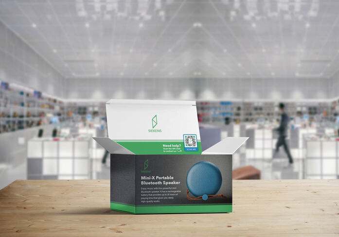 A Bluetooth speaker box with a QR Code on it sitting on a tabletop in a retail store. 
