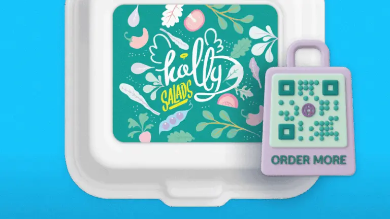 A Holly Salads takeout container with a QR code tag to reorder