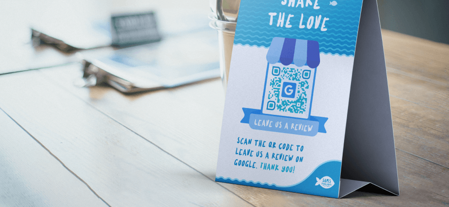 A table tent asking customers to leave a Google review via QR Code.