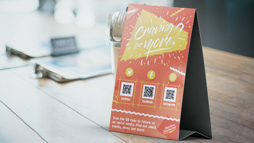 Example of a bad placement of social media QR Codes on a table tent