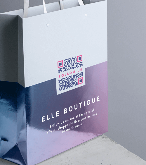 A shopping bag from a retail store with a QR Code that redirects users to all social media channels.