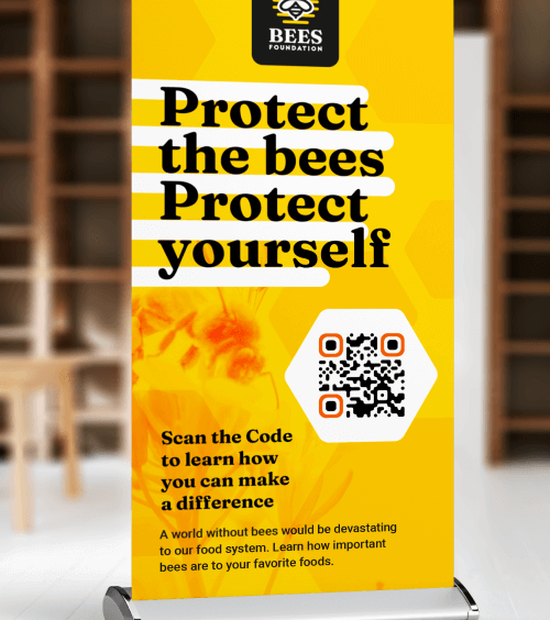 A table sign with an ad for a non-profit organization with a QR Code that redirects users to view a PDF version of their information booklet.