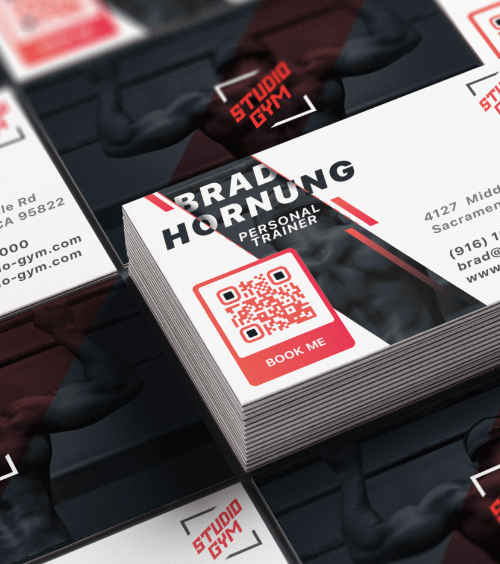 A business card of a personal trainer with a QR Code that displays business information of a gym.