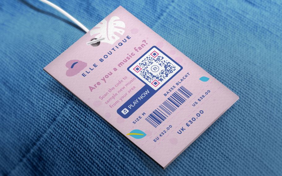 A pink Elle Boutique price tag that has a purple and white QR Code with a “B” logo in the center.