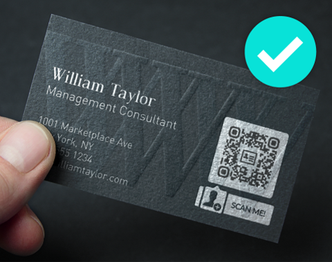 A black business card with a silver and black QR Code with a “scan me” call-to-action below it and a blue tick on the right.