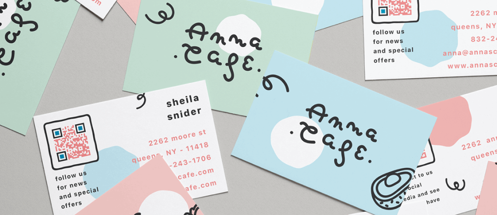 Anna Cafe’s pink, blue, and mint business cards that have QR Codes on opposite sides.