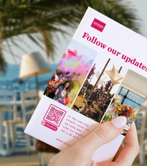 A table tent at an event with a QR Code that requests feedback from guests when scanned.