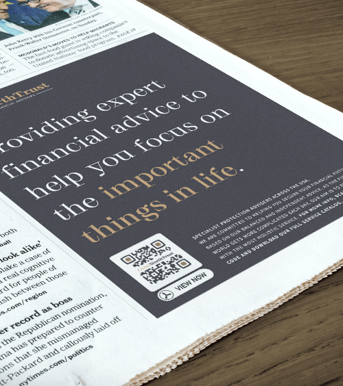 A newspaper advertisement with a QR Code that contains a financial advisory company’s full-service catalog in PDF format.