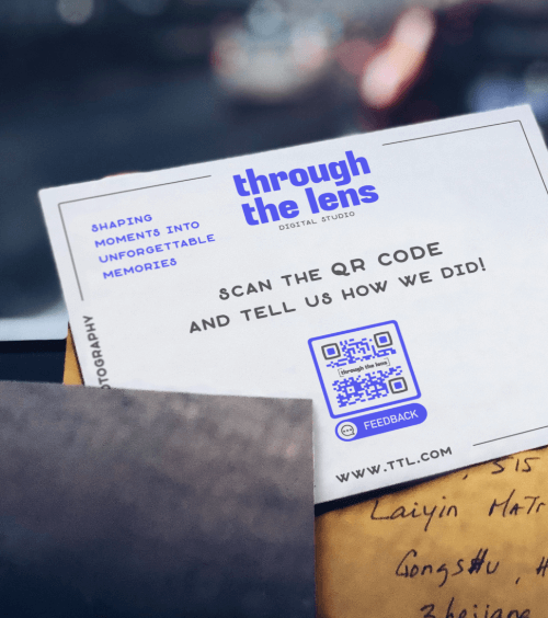 A postcard from a photography studio with a QR Code for customers to leave their feedback.