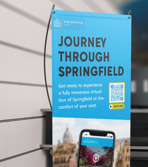 A banner promoting a city’s tourism with a QR Code that displays a video tour of the city.