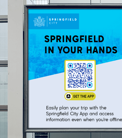 A billboard promoting a city’s app in Apple App Store and Google Play Store via QR Code.