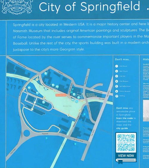 A large signboard in a city with a QR Code that contains a downloadable city guide in PDF format.