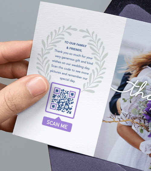Hands holding a letter with a thank you card for a wedding including a QR Code with a “Scan me” frame