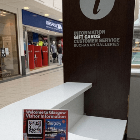 QR Code on a tabletent at an information point offering visitors more information about Glasgow with Downtown City Maps