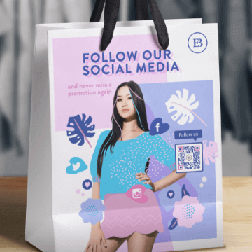 An example of a QR Code on a shopping bag with a frame CTA to get more social media follows.