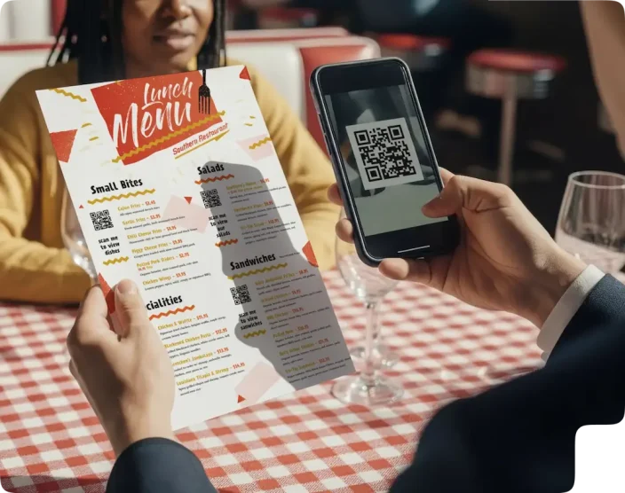 A person scanning a QR code on a restaurant menu with their smartphone